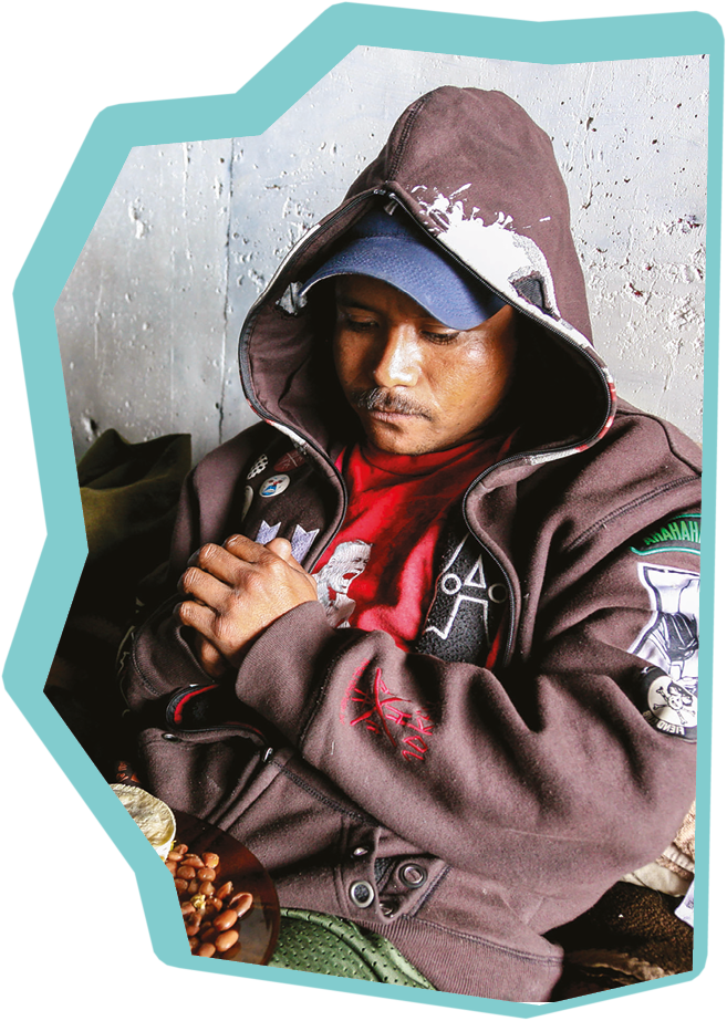 Tijuana, Mexico, Nov 12 - A homeless migrant in extreme poverty eat tortillas and beans in a tunnel of a dirty water canal near the border wall between the United States and Mexico in Tijuana, on the Pacific coast, near the San Ysidro international border station.