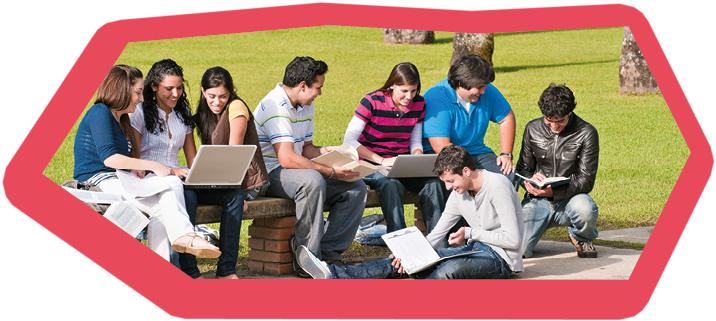 Group of students on the campus bench with laptops, books and looking to the monitor during an explanation.- 