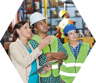 Company executive explaining order to shipping distribution warehouse workers