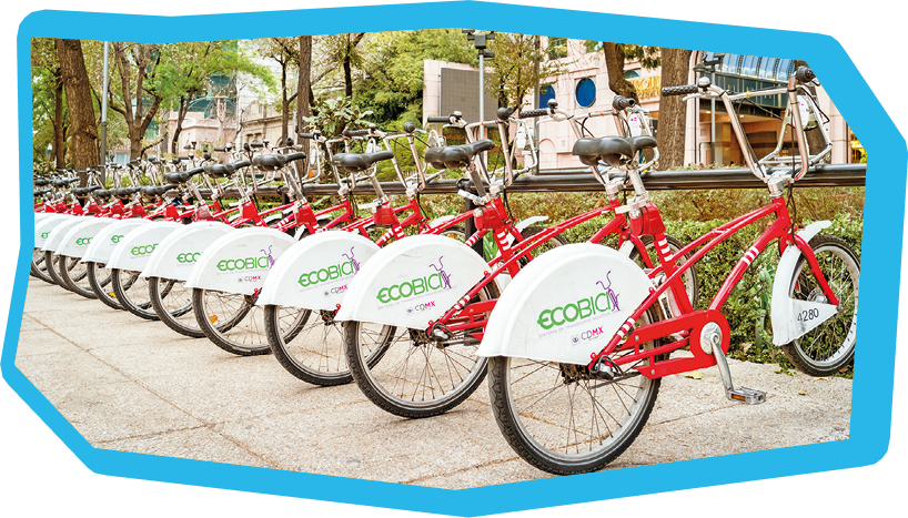 Bicycles stand in a row at a bicycle rental and sharing station located on Paseo de la Reforma, downtown Mexico City, Mexico.