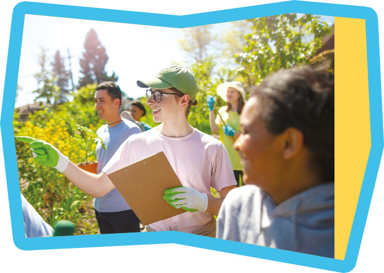 Young man student coordinates as manager leader the cleanup work for youth organization volunteer charity in local community garden public park in residential district in summer