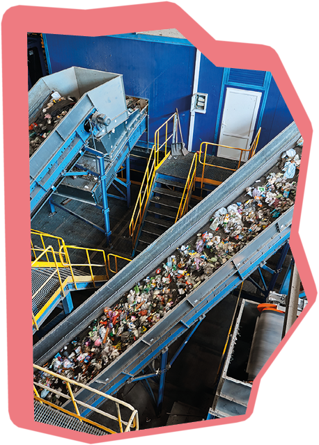 Large production line with conveyors carrying trash at waste recycling plant. Utilization technology of waste materials. Sustainable production