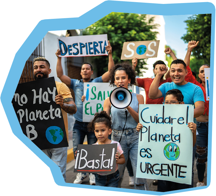 Protesters holding signs about the environment on the protest