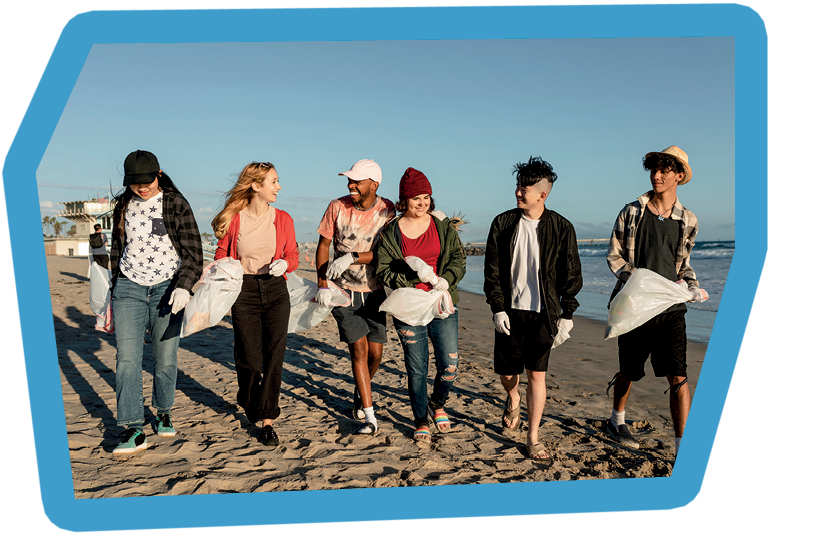 Young environmentalist friends, beach clean up volunteering