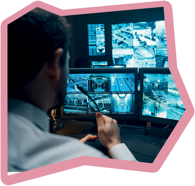 Police officers at surveillance control center wide