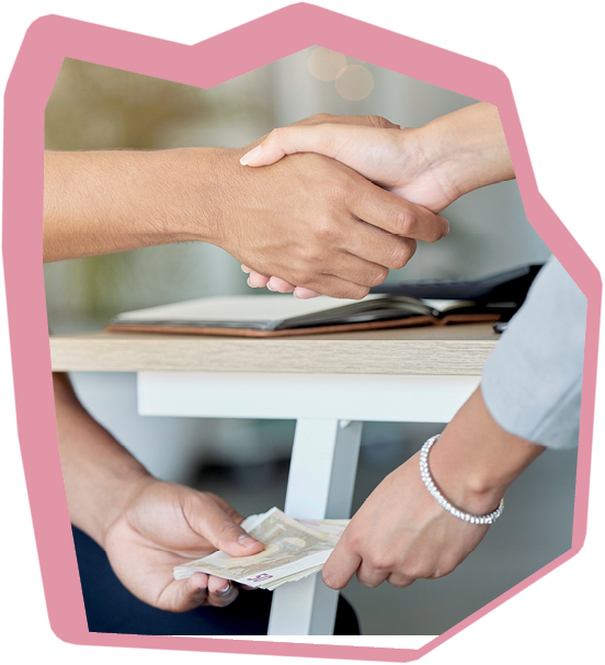 Business people agree to bribe and do handshake, giving money or cash payment below table. Employee or partnership make a deal for fraud, money laundering and corruption crime in a business meeting