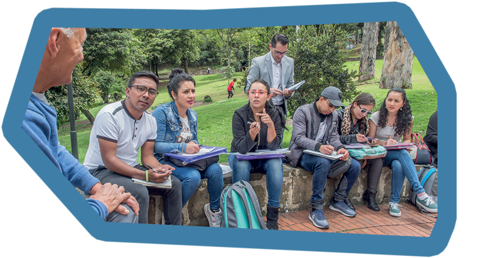 Bogota, Colombia - Sep 09, 2017: Young people, students sit and study in the street in front of the university in Bogota.