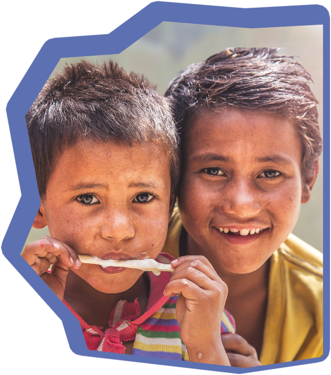 Poor big brother giving ice cream to little brother . They are wearing casual clothing and smiling