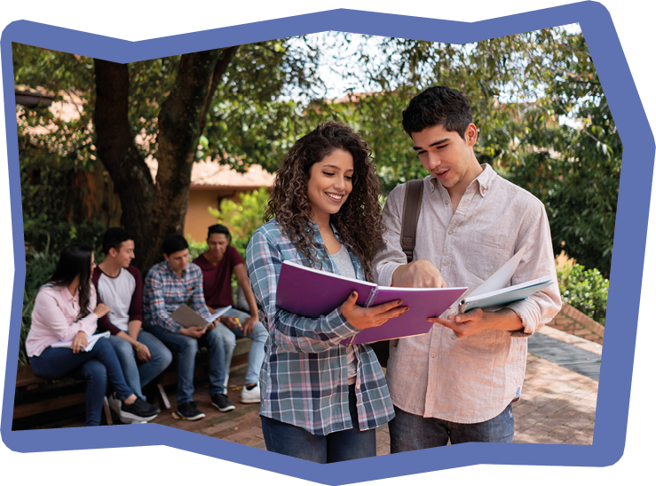 Couple of students studying outdoors at the university reading notes on a notebook - education concepts