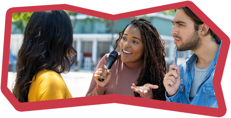 Black female journalist with latin reporter at interview outdoor in city