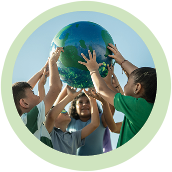 Children holding a planet outdoors