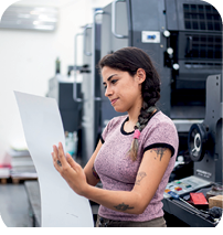 Young woman working in a printing press