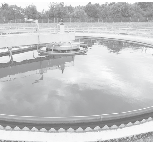 Modern urban wastewater treatment plant. Water cleaning facility outdoors. Water purification is the process of removing undesirable chemicals, suspended solids and gases from contaminated water.