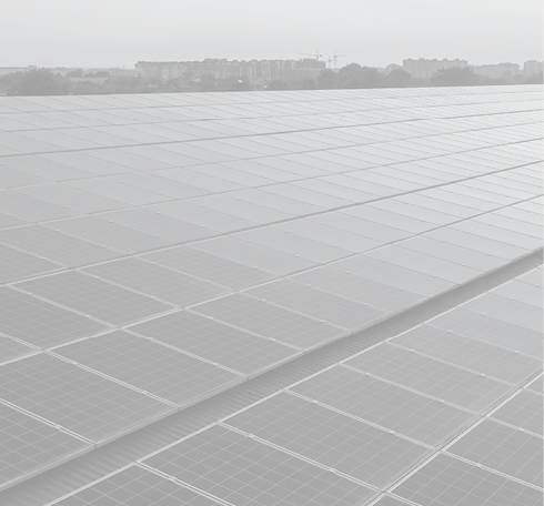 Blue photovoltaic solar panels mounted on building roof for producing clean ecological electricity at sunset. Production of renewable energy concept.