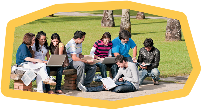 Group of students on the campus bench with laptops, books and looking to the monitor during an explanation.- 