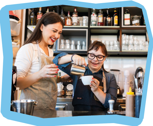 Young woman with Down Syndrome working at cafe
